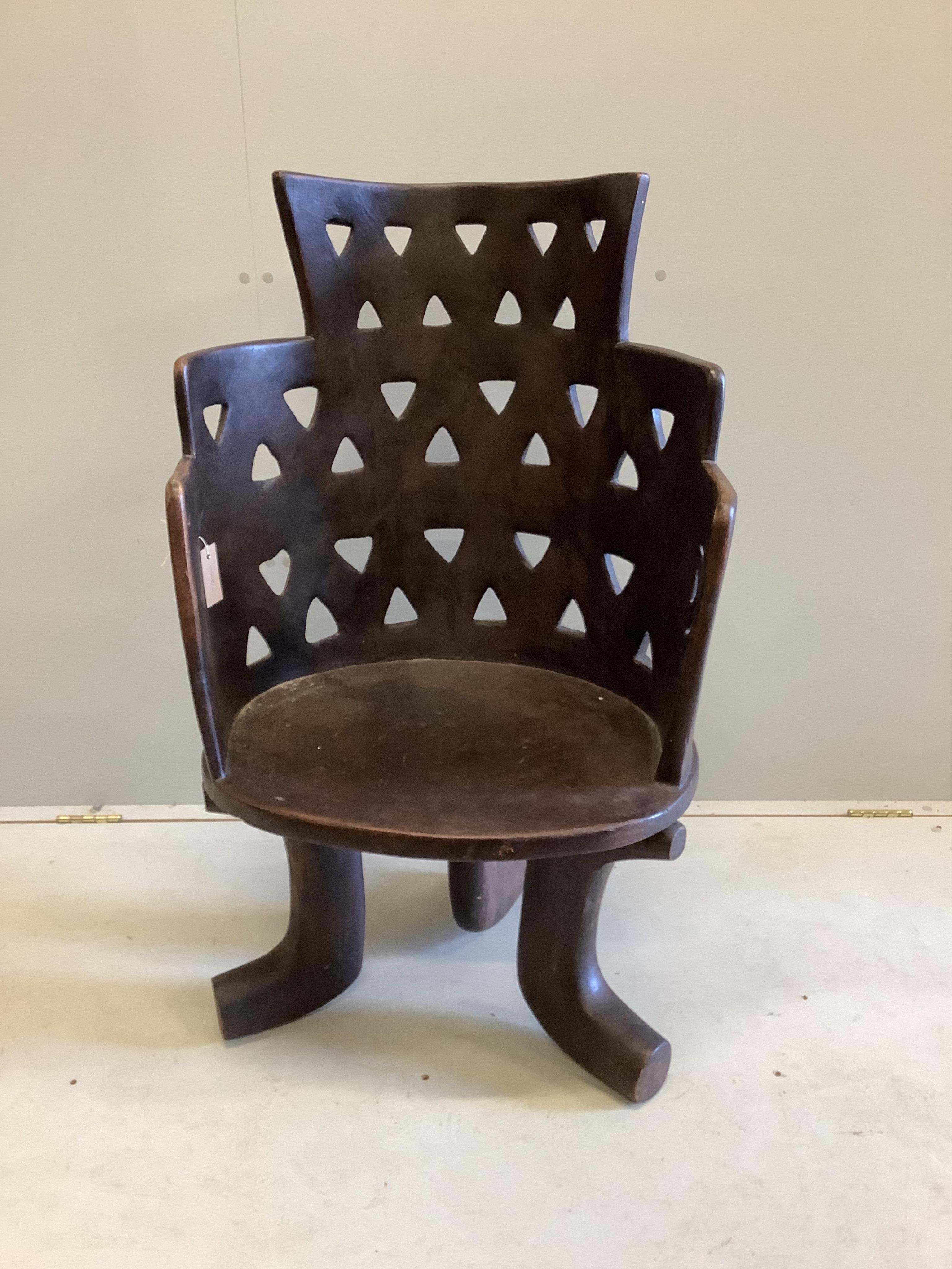 An African hardwood Jimma chair, width 62cm, depth 52cm, height 103cm